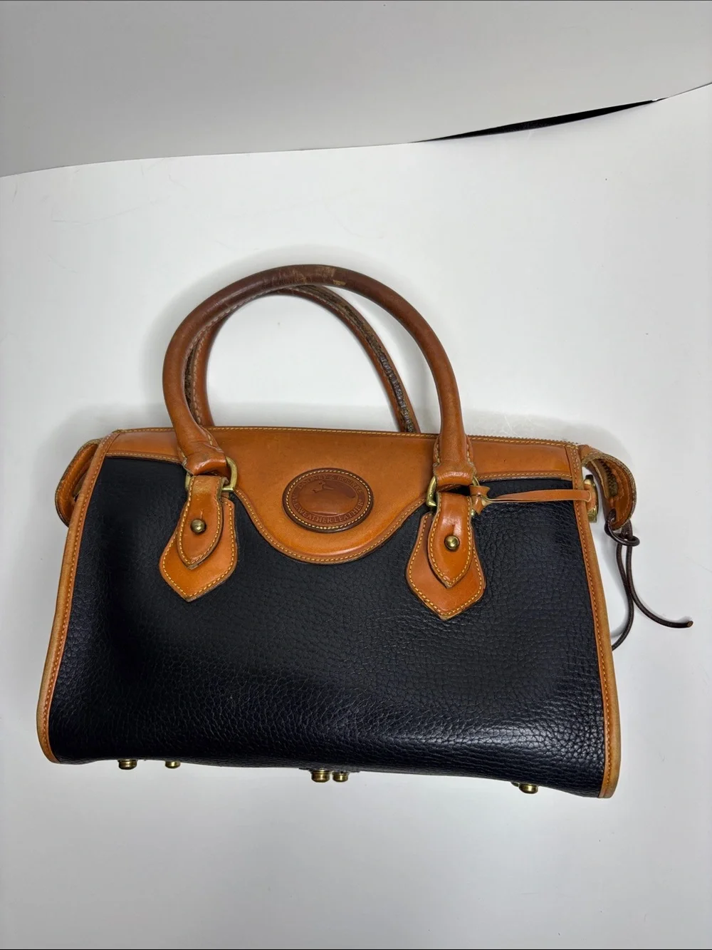 Dooney & Bourke Black Pebbled Leather Satchel with Tan Trim
